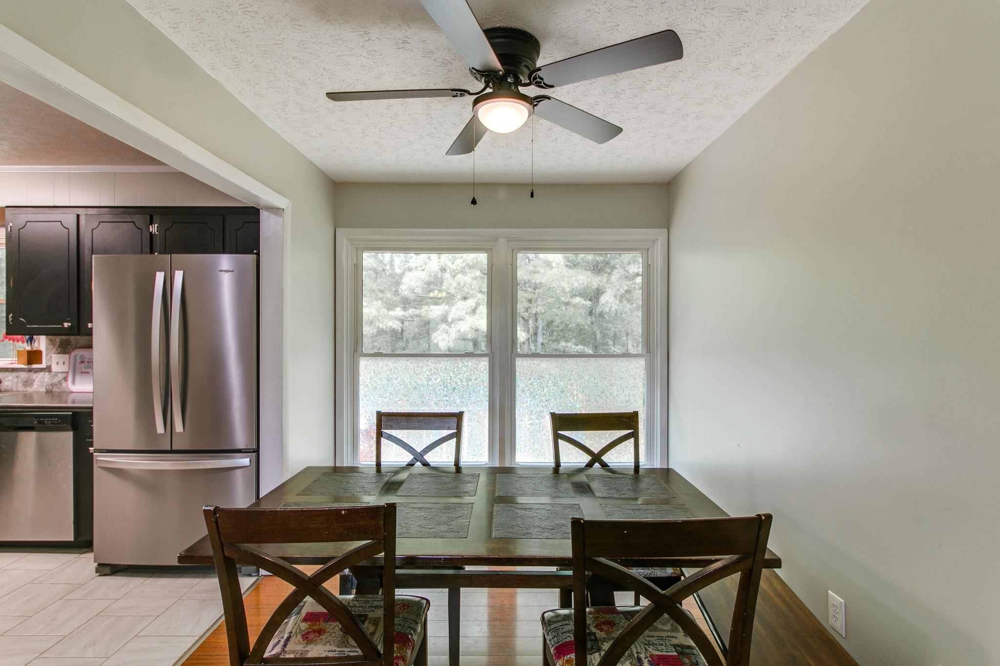 330 Cooley Ford Road Tennessee Ridge, TN 37178 - Photo 9 of 29 a view of a dining room with furniture window and outside view
