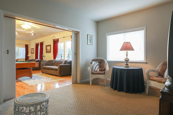 1050 Spring Road Shelter Cove, CA 95589 - Photo 22 of 42 a living room with furniture and a lamp