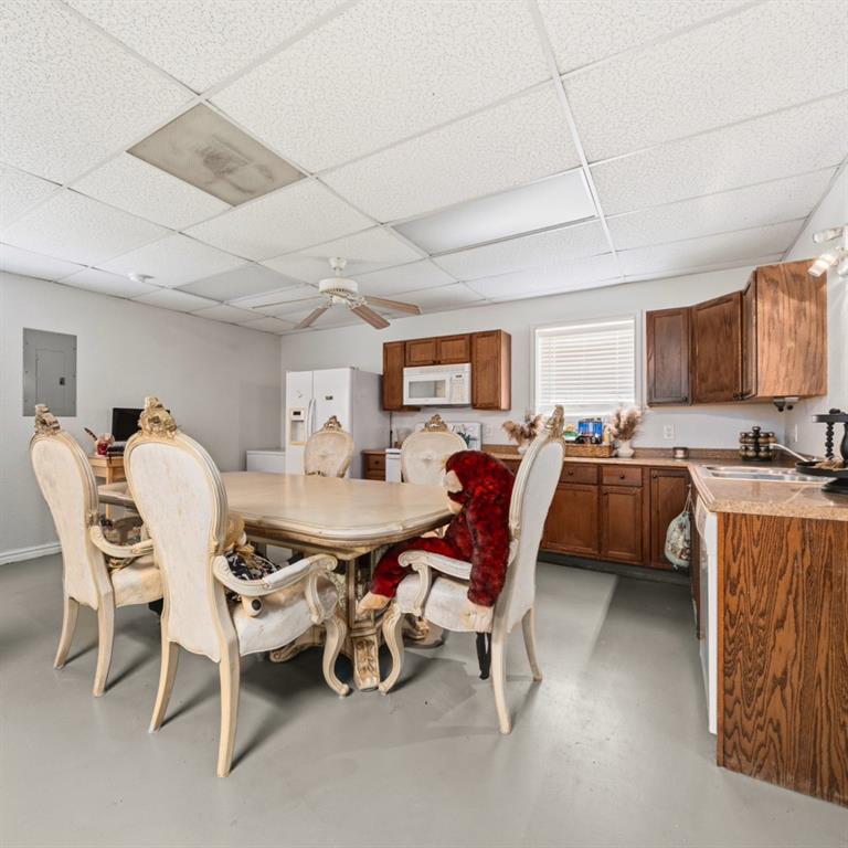 785 Tweedy Road Valley Mills, TX 76689 - Photo 31 of 40 Open-concept room featuring light-toned flooring and a drop ceiling with integrated lighting