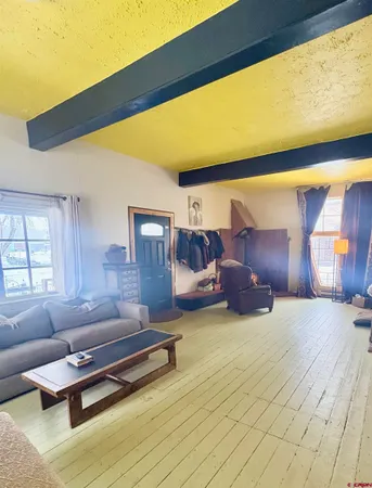 a room with kitchen island granite countertop furniture and a kitchen view