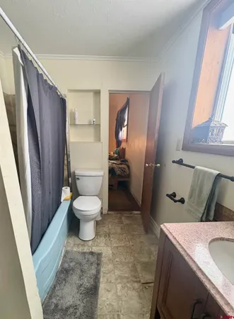 a bed room with furniture and a window