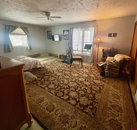 wooden floor with furniture and a flat screen tv