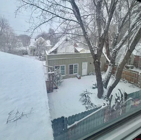 a bedroom with bed and window