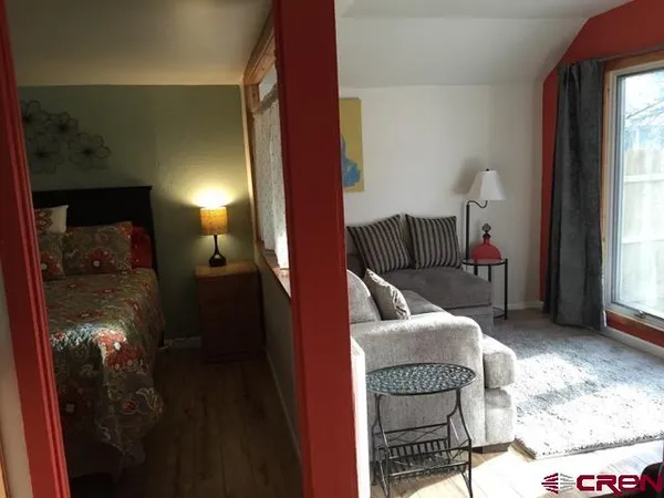 a kitchen with granite countertop a sink stove and cabinets