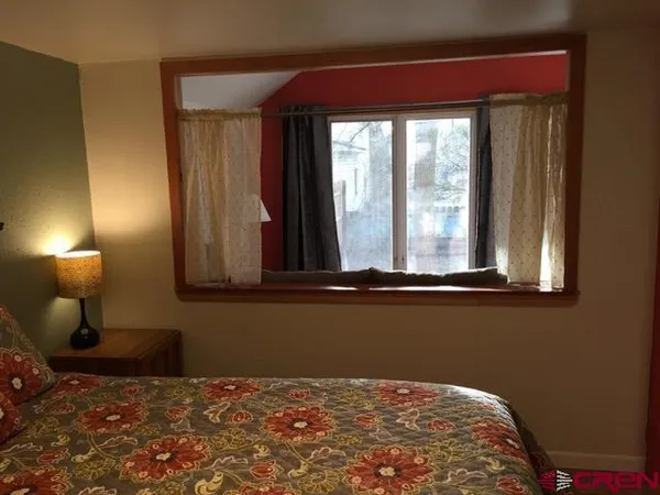 a view of a house with a snow in the yard