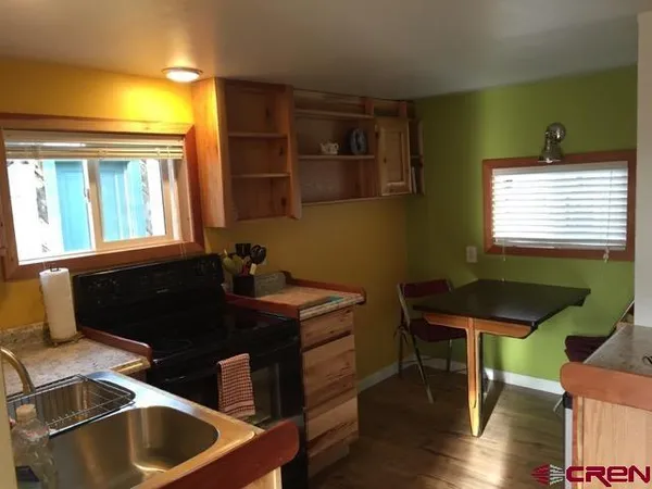 a front view of house with yard and seating space