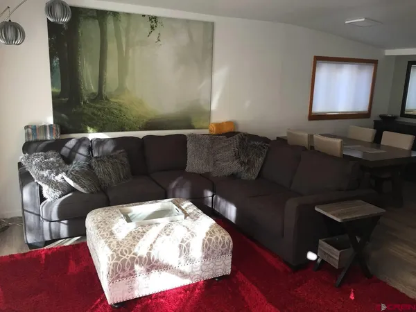 a street view covered with snow in front of house