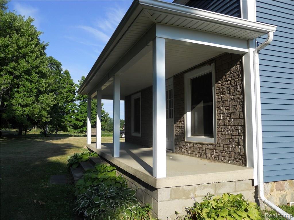 1087 West Murphy Lake Road Fostoria, MI 48435 - Photo 6 of 26 front porch view.JPG