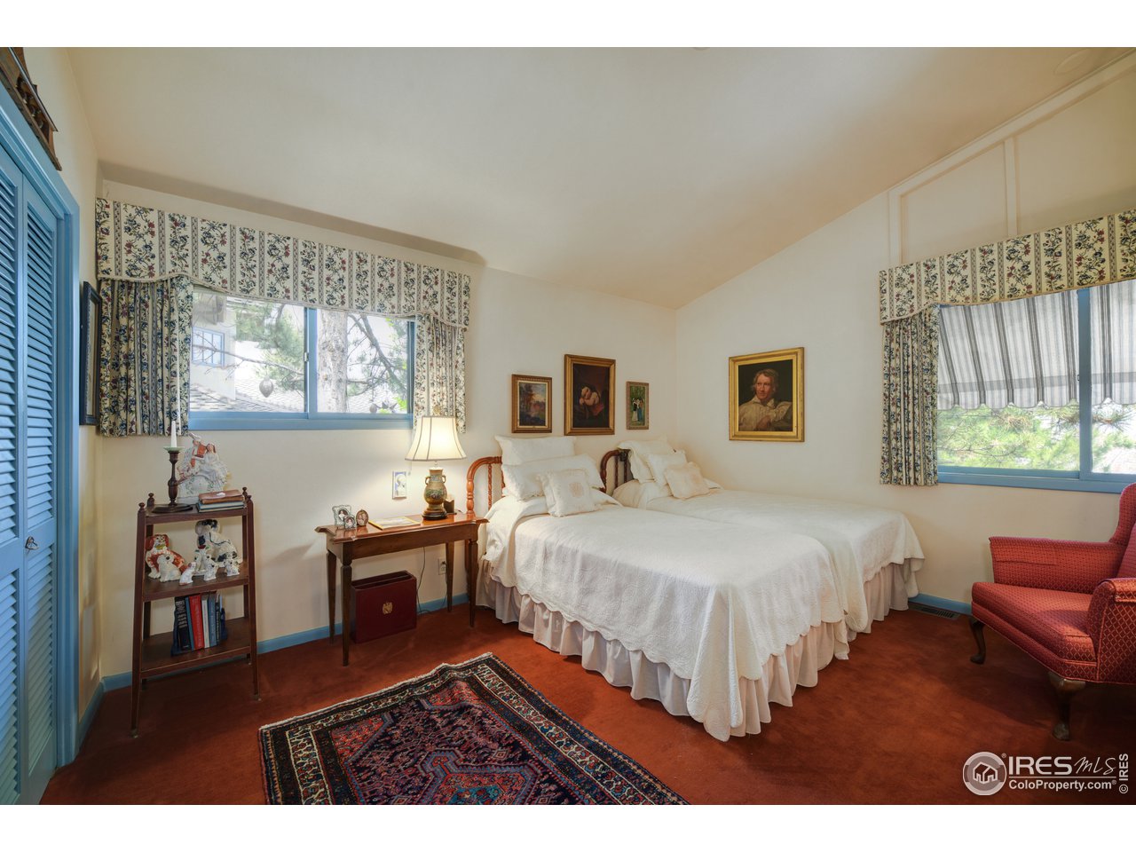 550 13th Street Boulder, CO 80302 - Photo 11 of 26 a bedroom with a bed and wooden floor