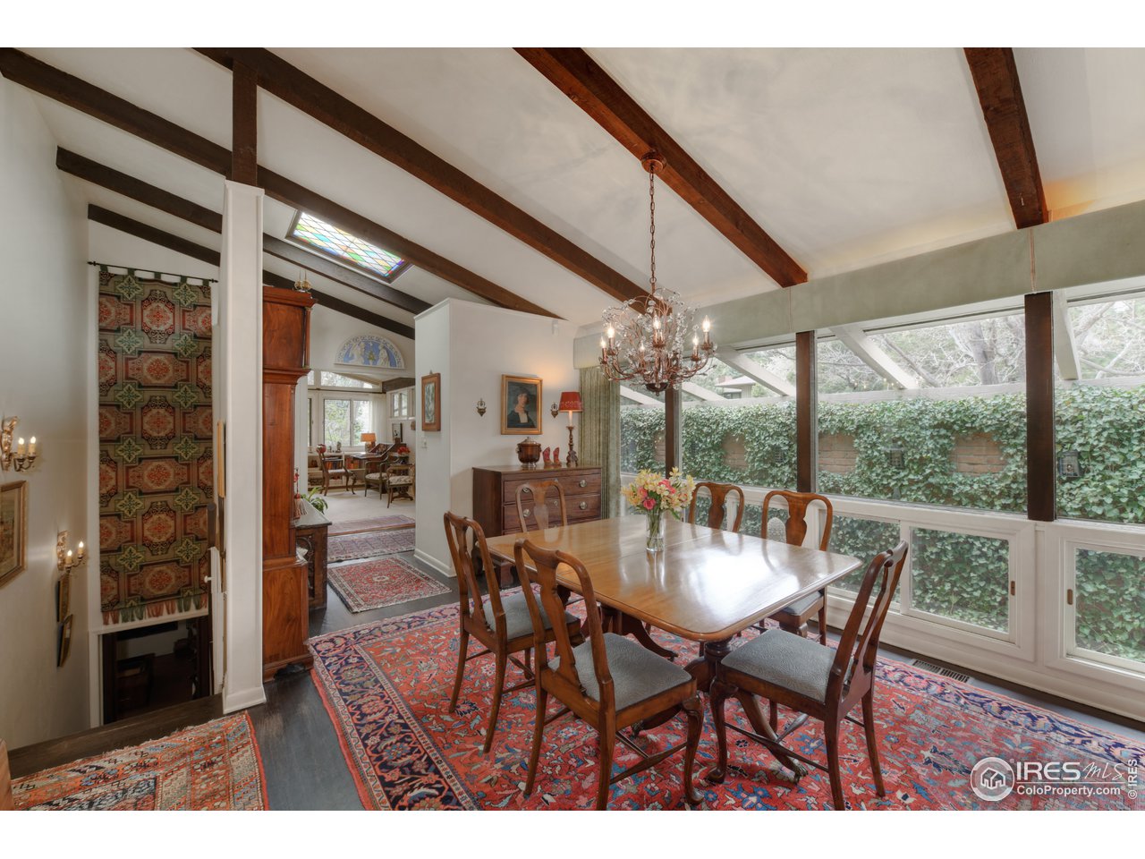 550 13th Street Boulder, CO 80302 - Photo 5 of 26 a dining room with furniture a chandelier and window