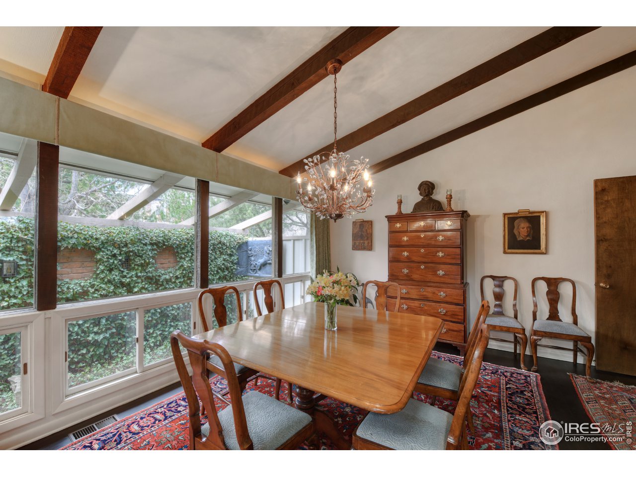 550 13th Street Boulder, CO 80302 - Photo 6 of 26 a dining room with furniture a chandelier and wooden floor