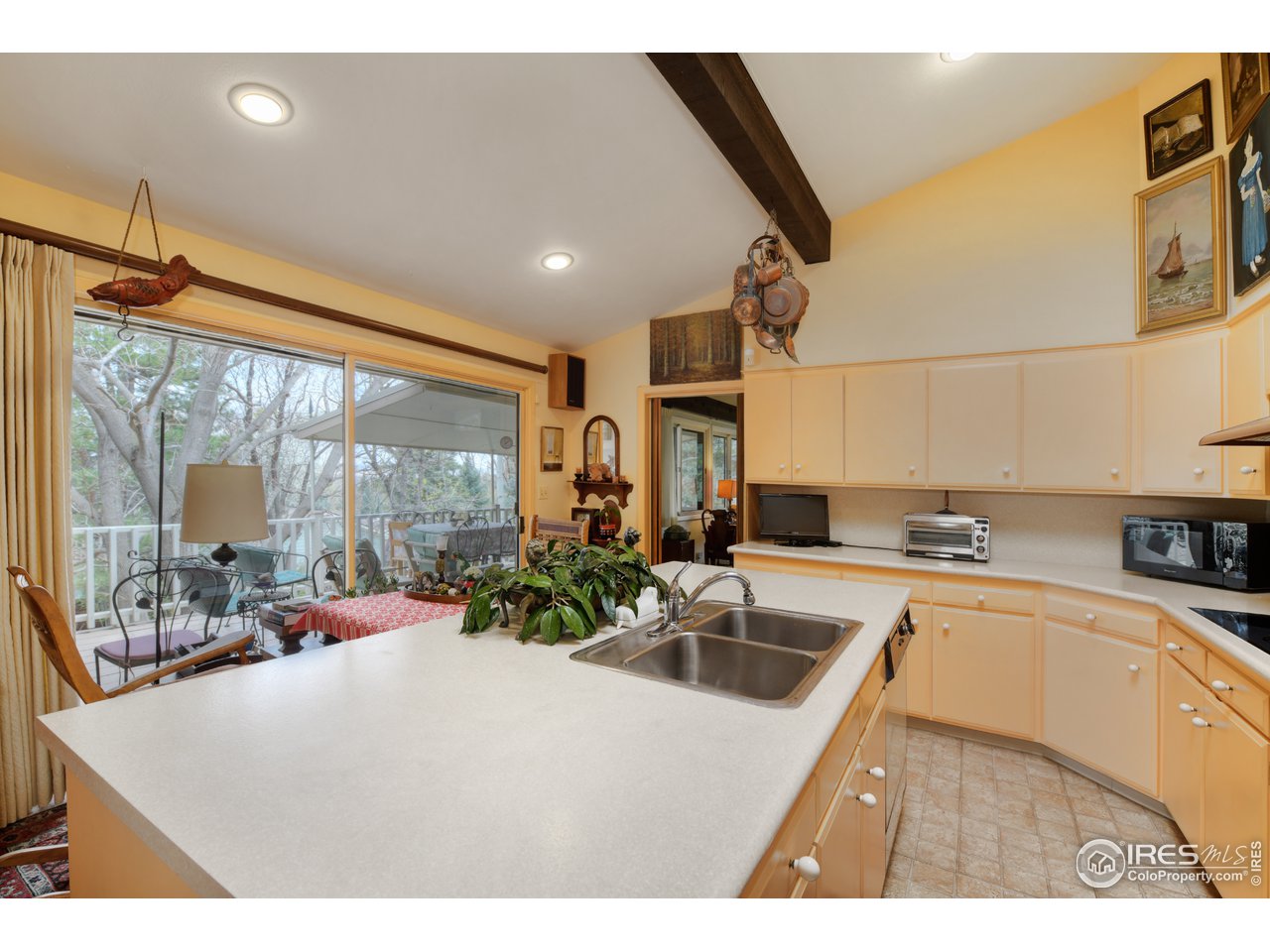 550 13th Street Boulder, CO 80302 - Photo 7 of 26 a kitchen with sink refrigerator and large window
