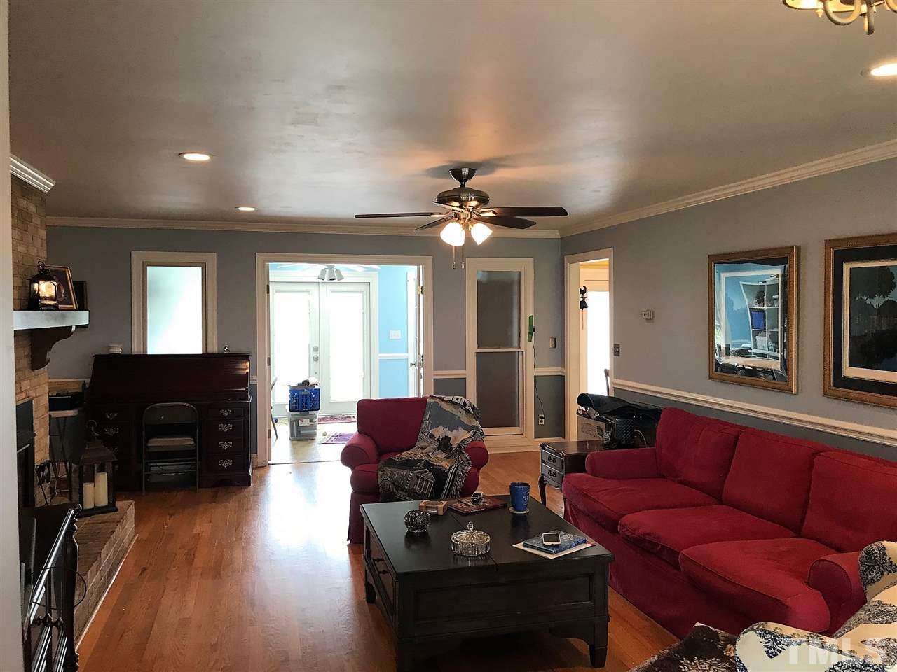 841 Pilot-Riley Road Zebulon, NC 27597 - Photo 8 of 29 a living room with furniture and wooden floor