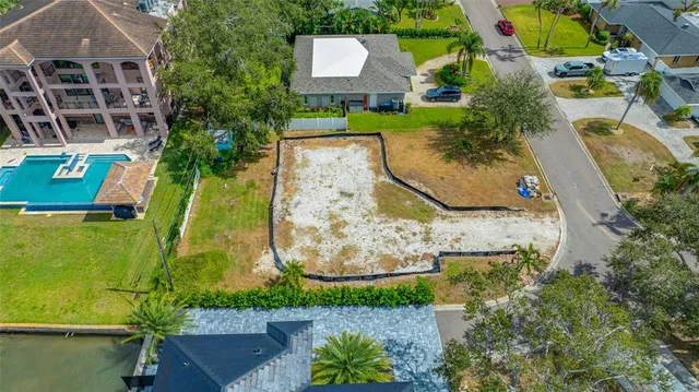 an aerial view of a house with a garden and trees