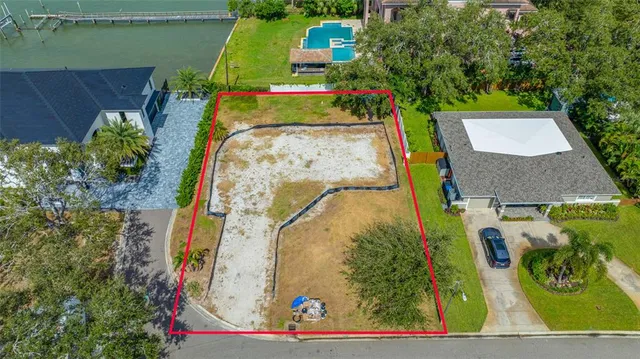 an aerial view of residential house with outdoor space and swimming pool