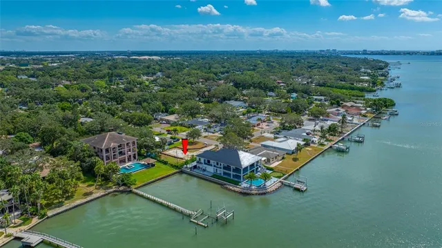 an aerial view of a houses with a yard
