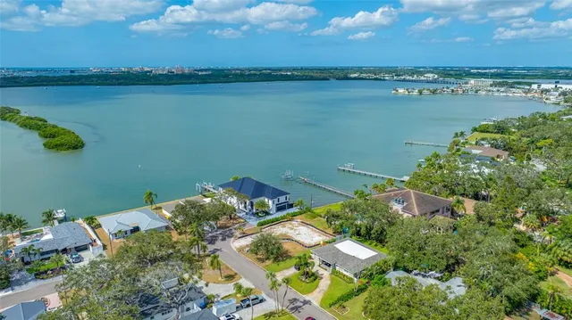 an aerial view of a houses with ocean view