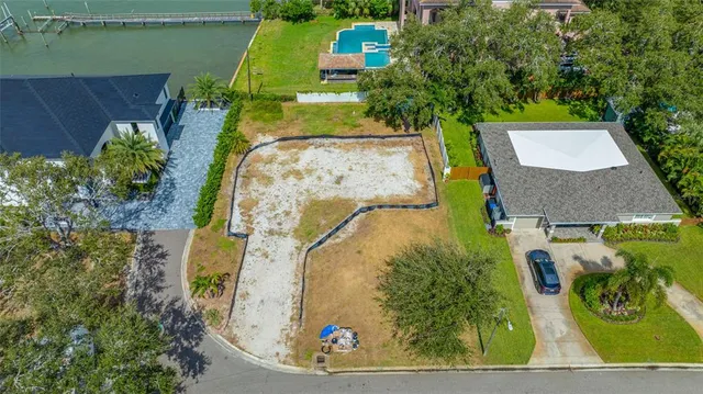 an aerial view of a house with outdoor space