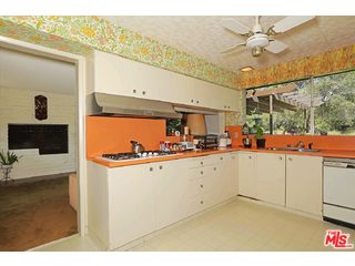 12251 Castlegate Drive Los Angeles, CA 90049 - Photo 14 of 38 a view of kitchen with cabinets