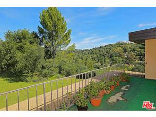 12251 Castlegate Drive Los Angeles, CA 90049 - Photo 22 of 38 a view of a balcony