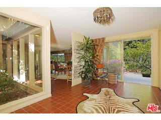 12251 Castlegate Drive Los Angeles, CA 90049 - Photo 5 of 38 a view of entryway and hall with wooden floor