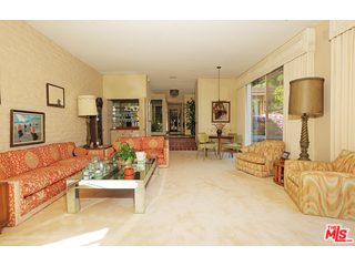 12251 Castlegate Drive Los Angeles, CA 90049 - Photo 9 of 38 a living room with furniture and a couch