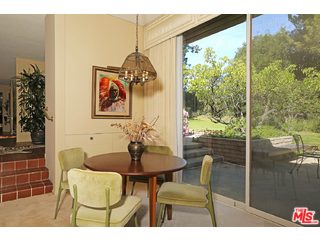 12251 Castlegate Drive Los Angeles, CA 90049 - Photo 10 of 38 a outdoor dining space with furniture and garden view