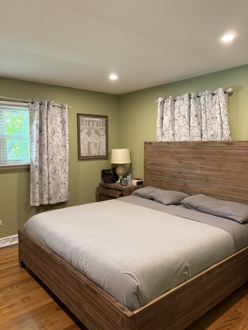 609 West Gartner Road Naperville, IL 60540 - Photo 8 of 23 a bedroom with a large bed and a window