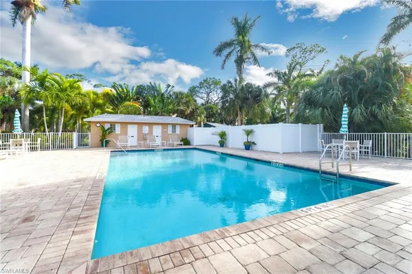 a view of a swimming pool with a patio