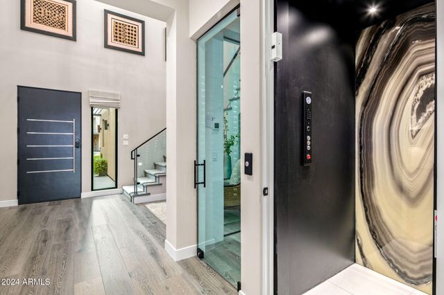 a living room with fireplace furniture and a flat screen tv