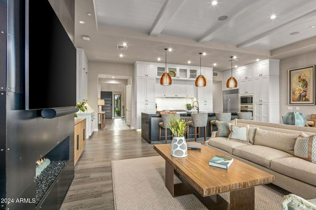 a kitchen with a sink appliances and a dining table