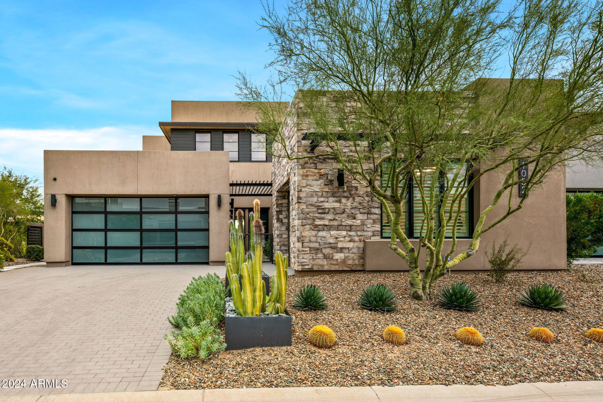 37200 North Cave Creek Road, Unit 1082 Scottsdale, AZ 85262 - Photo 2 of 66 a front view of a house with plants
