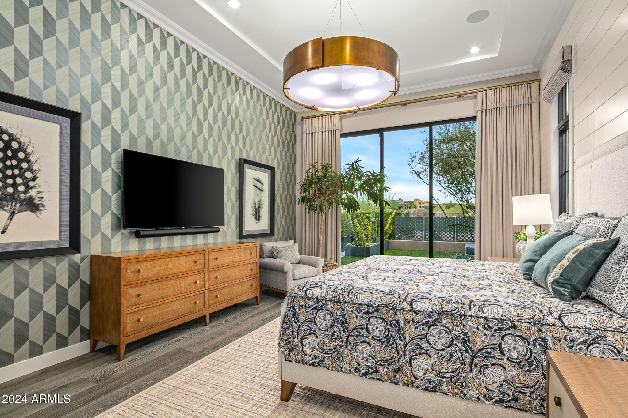 37200 North Cave Creek Road, Unit 1082 Scottsdale, AZ 85262 - Photo 28 of 66 a bedroom with a large bed and a flat screen tv