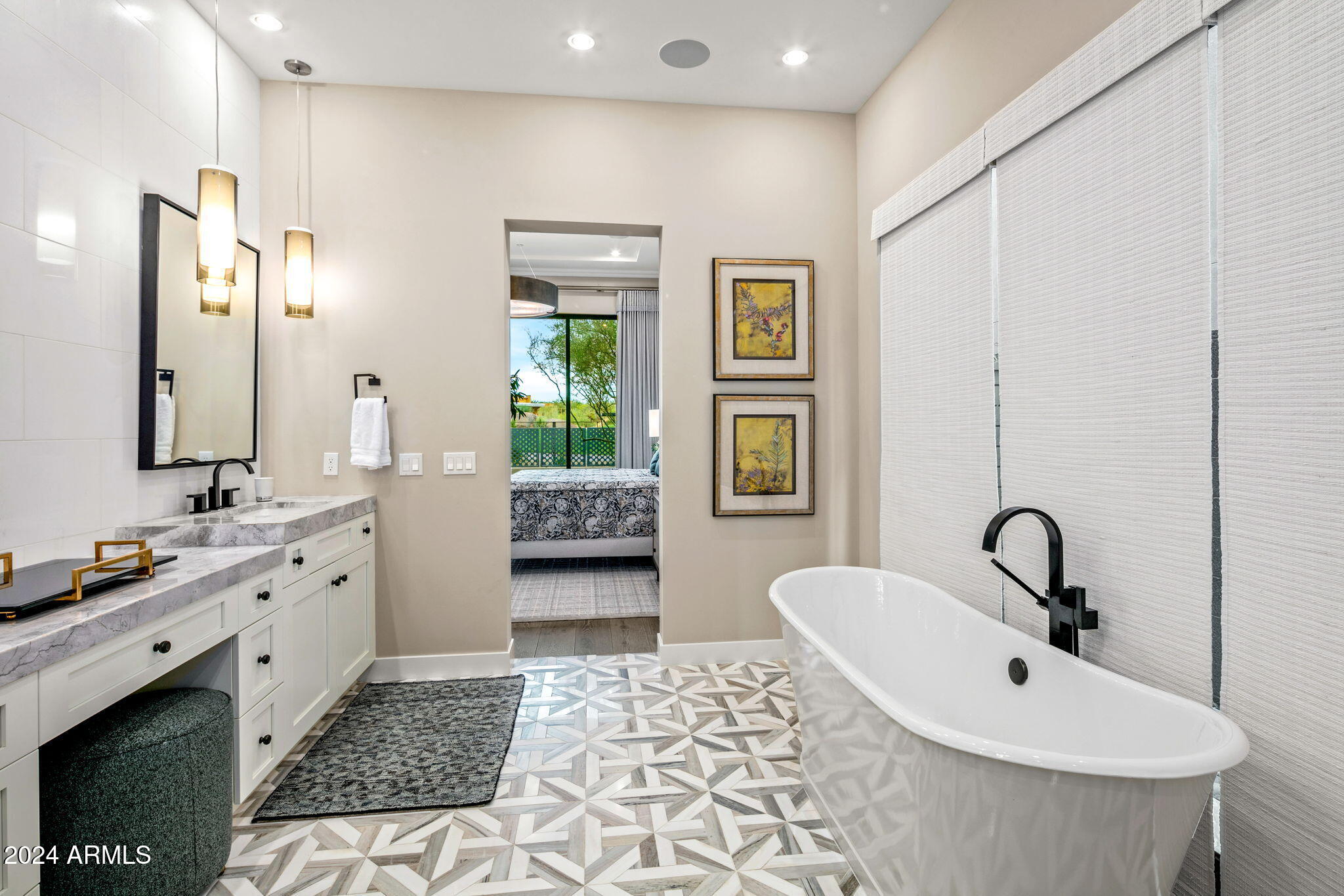 37200 North Cave Creek Road, Unit 1082 Scottsdale, AZ 85262 - Photo 31 of 66 a bathroom with a double vanity sink a mirror and a bathtub