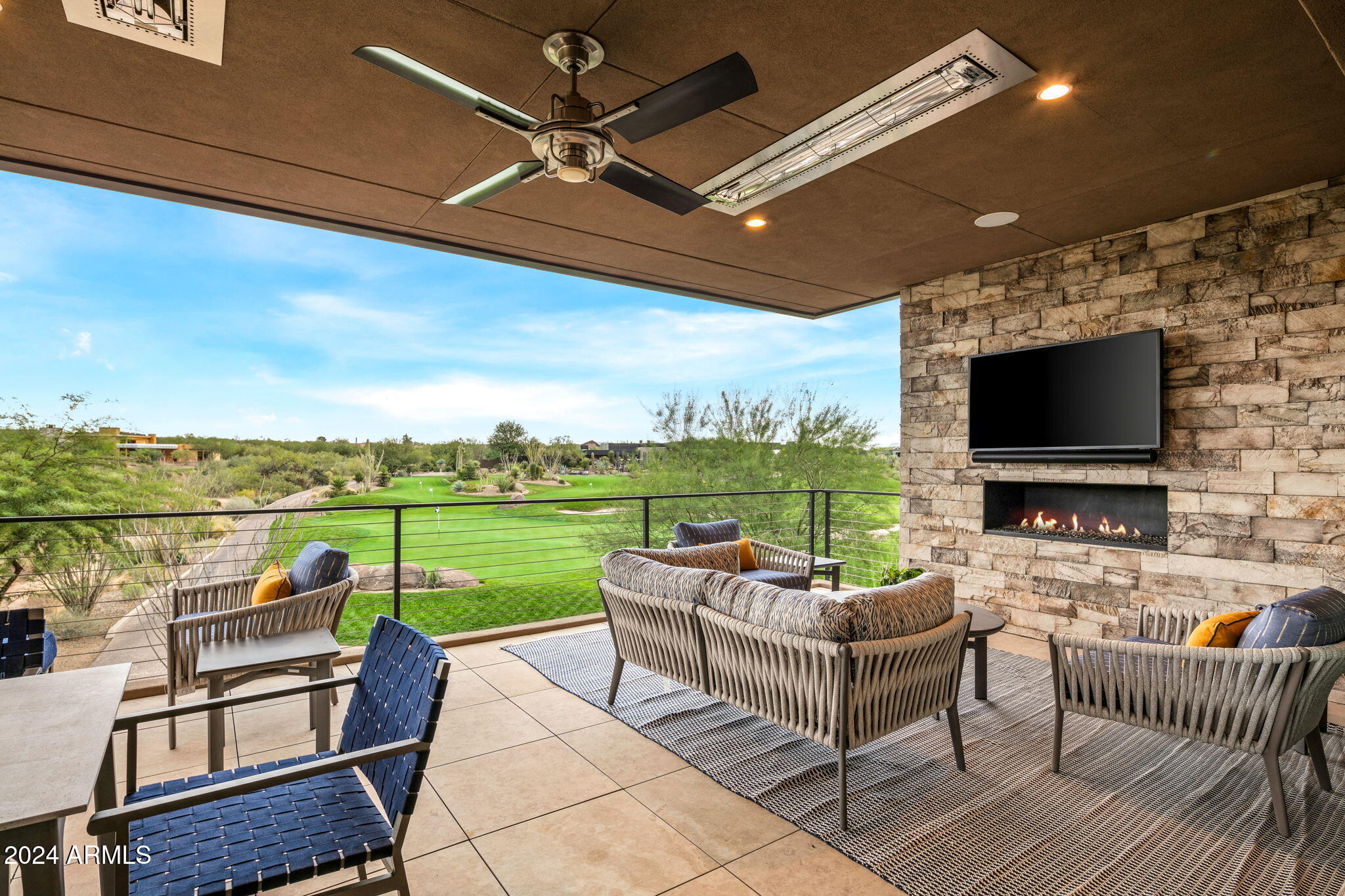 37200 North Cave Creek Road, Unit 1082 Scottsdale, AZ 85262 - Photo 54 of 66 a outdoor living space with furniture and a flat screen tv