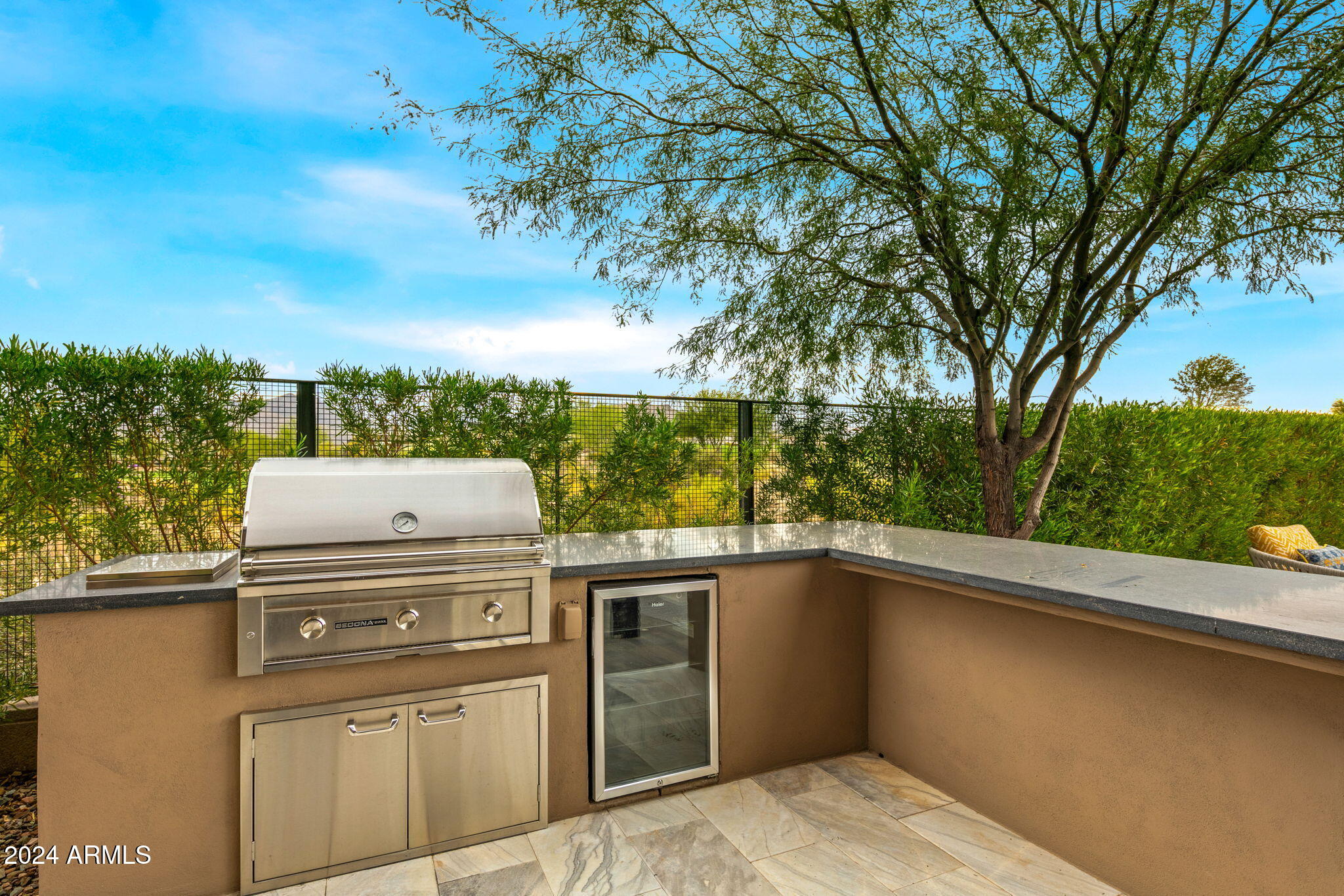 37200 North Cave Creek Road, Unit 1082 Scottsdale, AZ 85262 - Photo 61 of 66 a view of a kitchen with a stove and a large tree