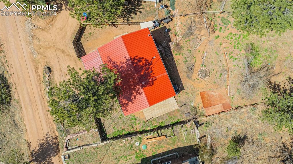 8228 Highway 24 Cascade, CO 80809 - Photo 28 of 36 view of balcony with wooden floor and outdoor seating