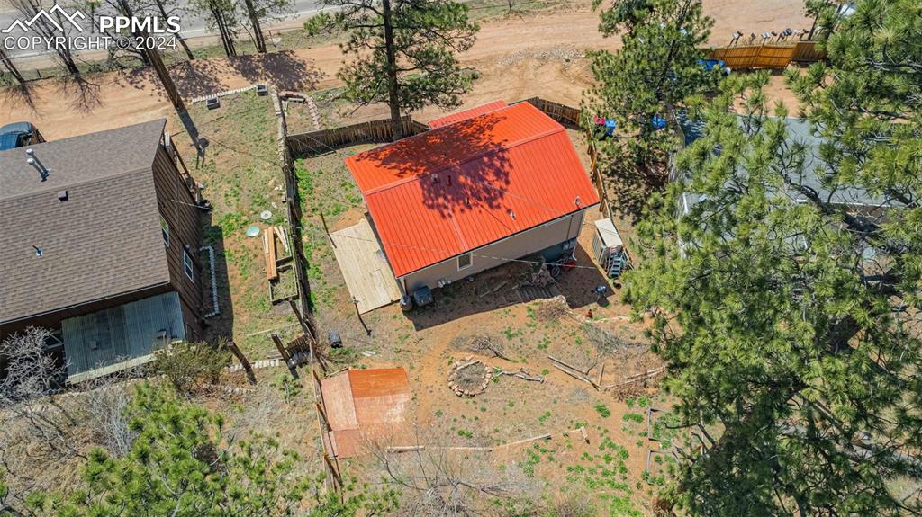 8228 Highway 24 Cascade, CO 80809 - Photo 29 of 36 an aerial view of a house with a yard and wooden fence