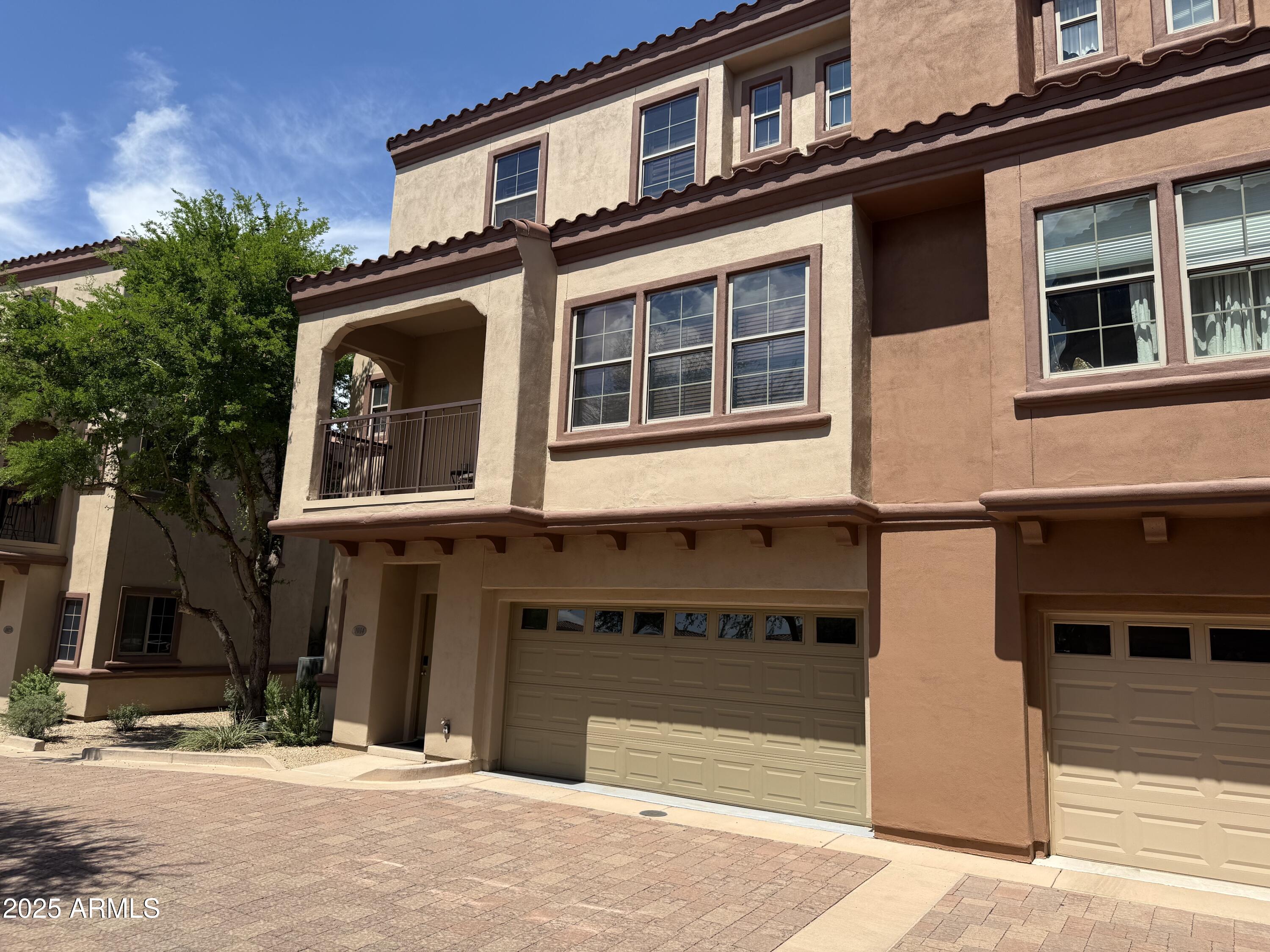 3935 East Rough Rider Road, Unit 1014 Phoenix, AZ 85050 - Photo 3 of 40 front view of a building