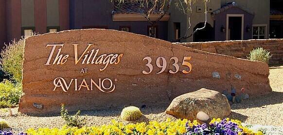 3935 East Rough Rider Road, Unit 1014 Phoenix, AZ 85050 - Photo 40 of 40 a sign that is on the side of a building