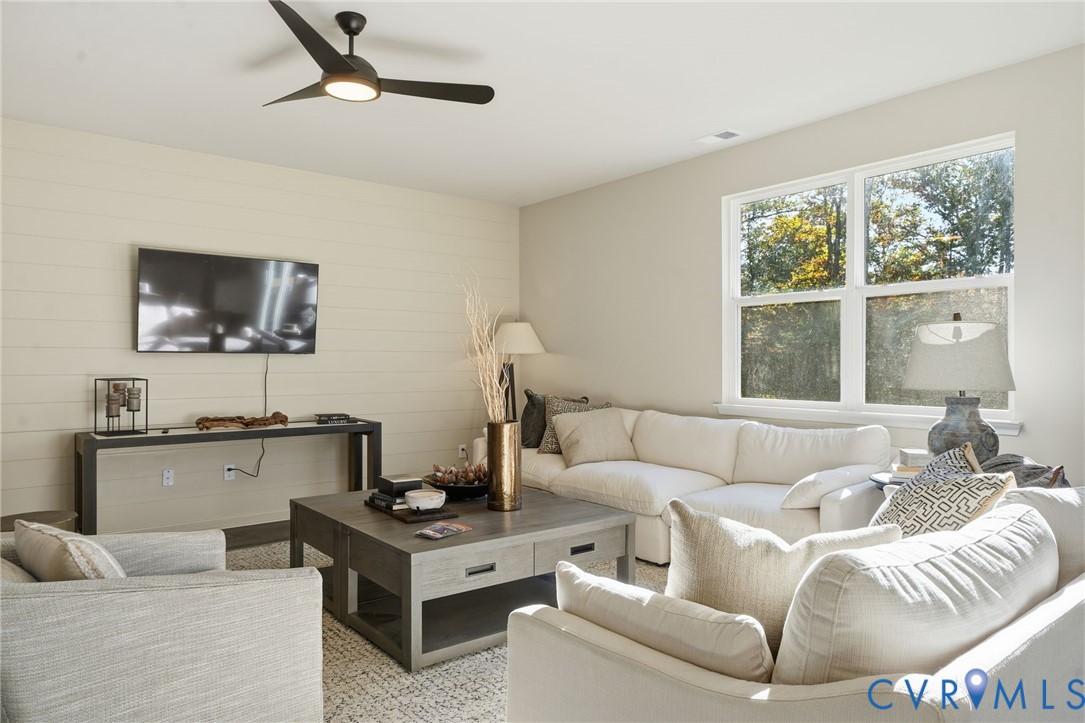 6338 Sterling Way Ruther Glen, VA 22546 - Photo 12 of 47 a living room with furniture and a flat screen tv