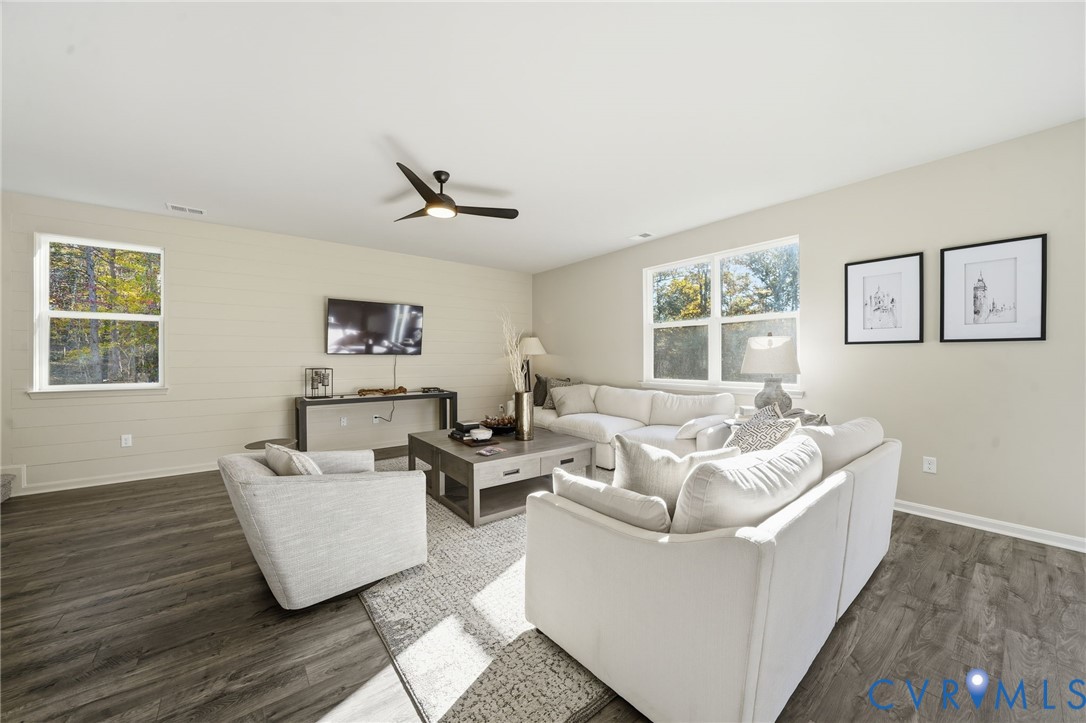 6338 Sterling Way Ruther Glen, VA 22546 - Photo 13 of 47 a living room with furniture and windows