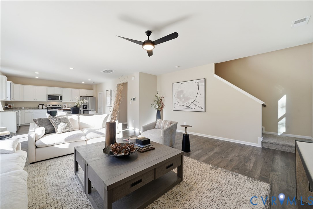 6338 Sterling Way Ruther Glen, VA 22546 - Photo 17 of 47 a living room with furniture and a wooden floor