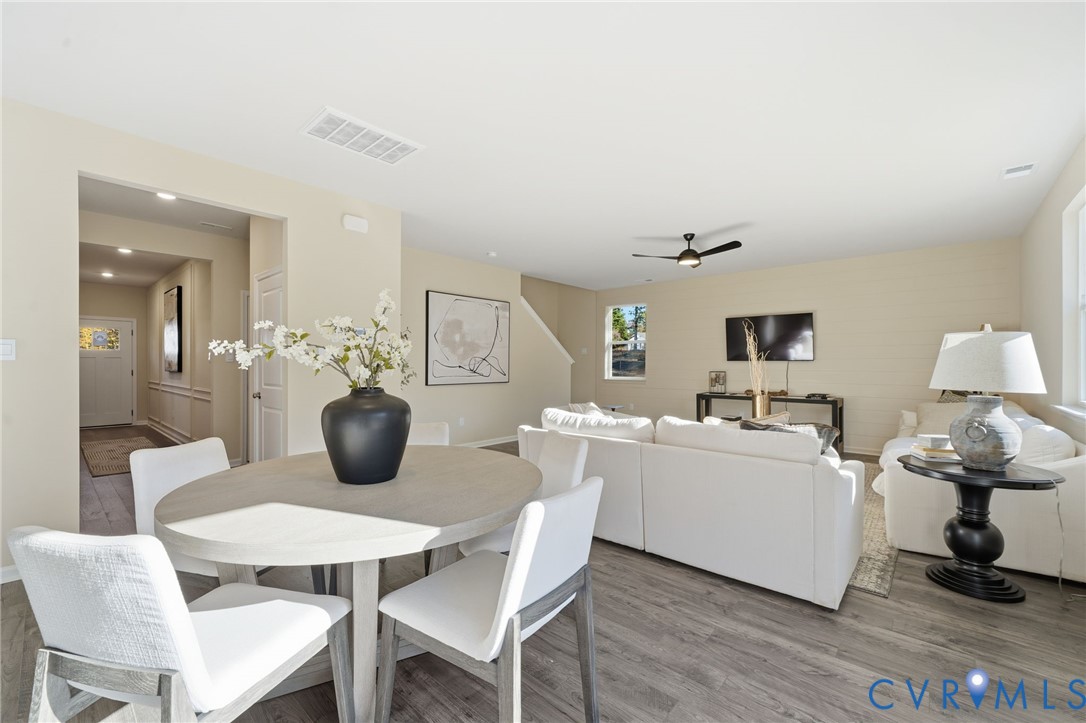 6338 Sterling Way Ruther Glen, VA 22546 - Photo 27 of 47 a view of a dining room with furniture and wooden floor