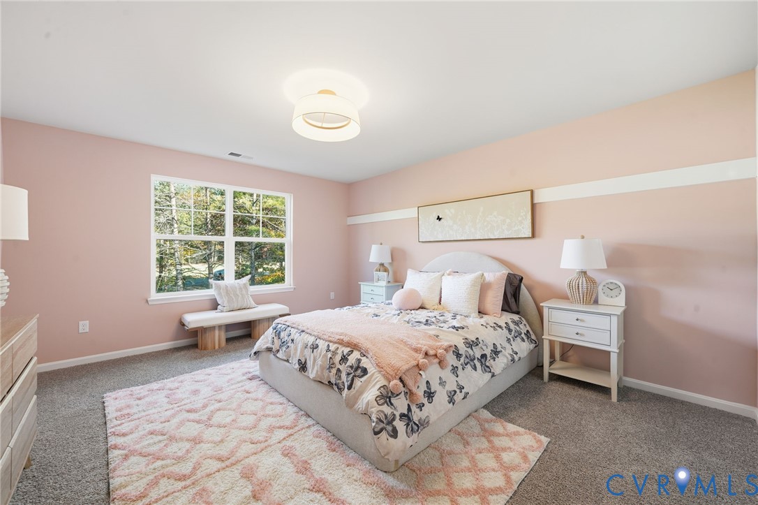 6338 Sterling Way Ruther Glen, VA 22546 - Photo 31 of 47 a bedroom with a bed and a window