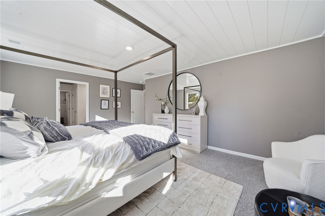 6338 Sterling Way Ruther Glen, VA 22546 - Photo 35 of 47 a bedroom with a bed a mirror and lamp