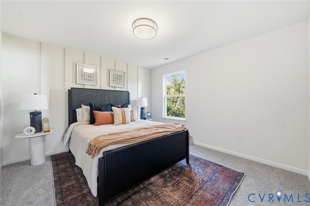 6338 Sterling Way Ruther Glen, VA 22546 - Photo 36 of 47 a bedroom with a bed and a window