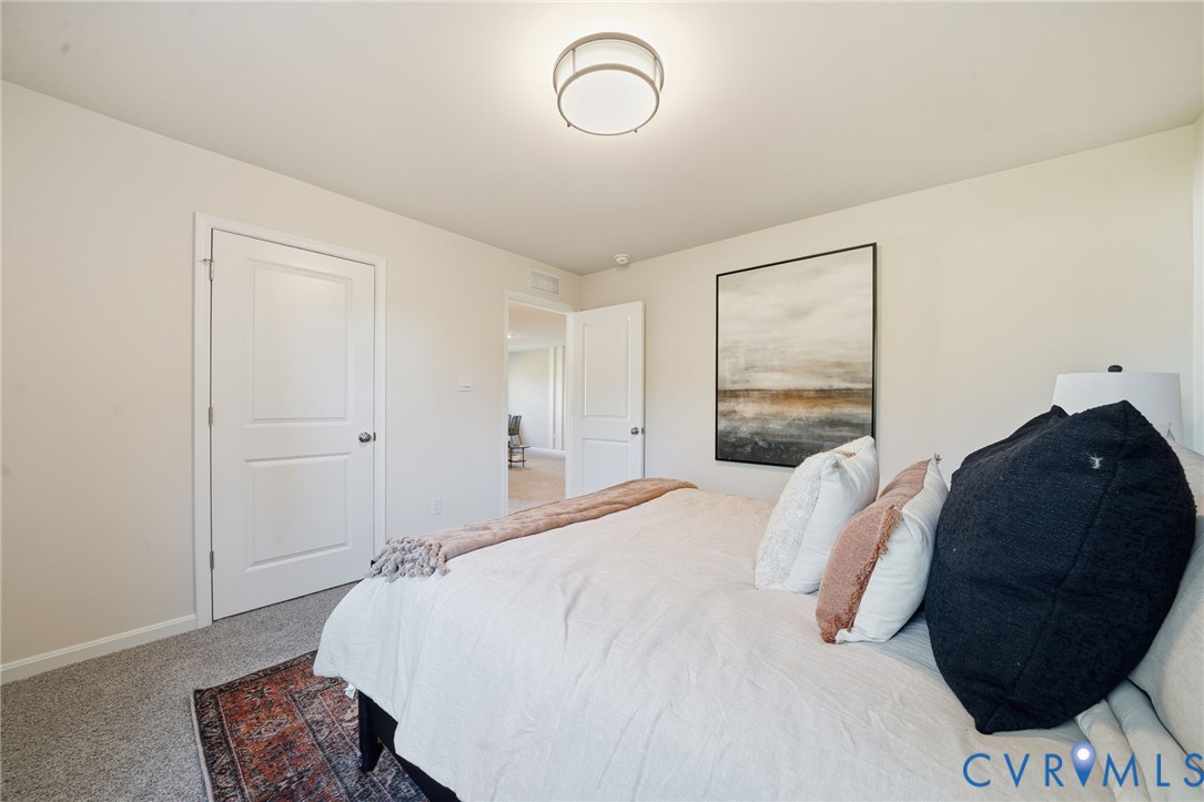 6338 Sterling Way Ruther Glen, VA 22546 - Photo 37 of 47 a bedroom with a bed and a window