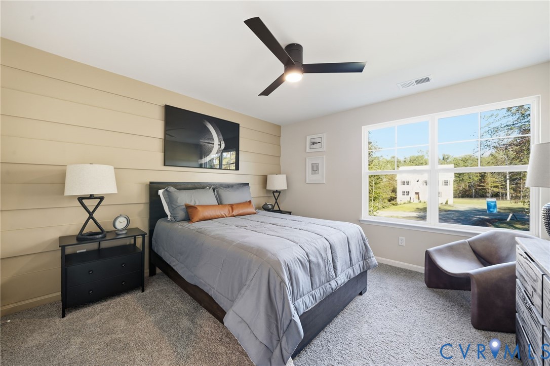 6338 Sterling Way Ruther Glen, VA 22546 - Photo 38 of 47 a bedroom with a bed and a large window