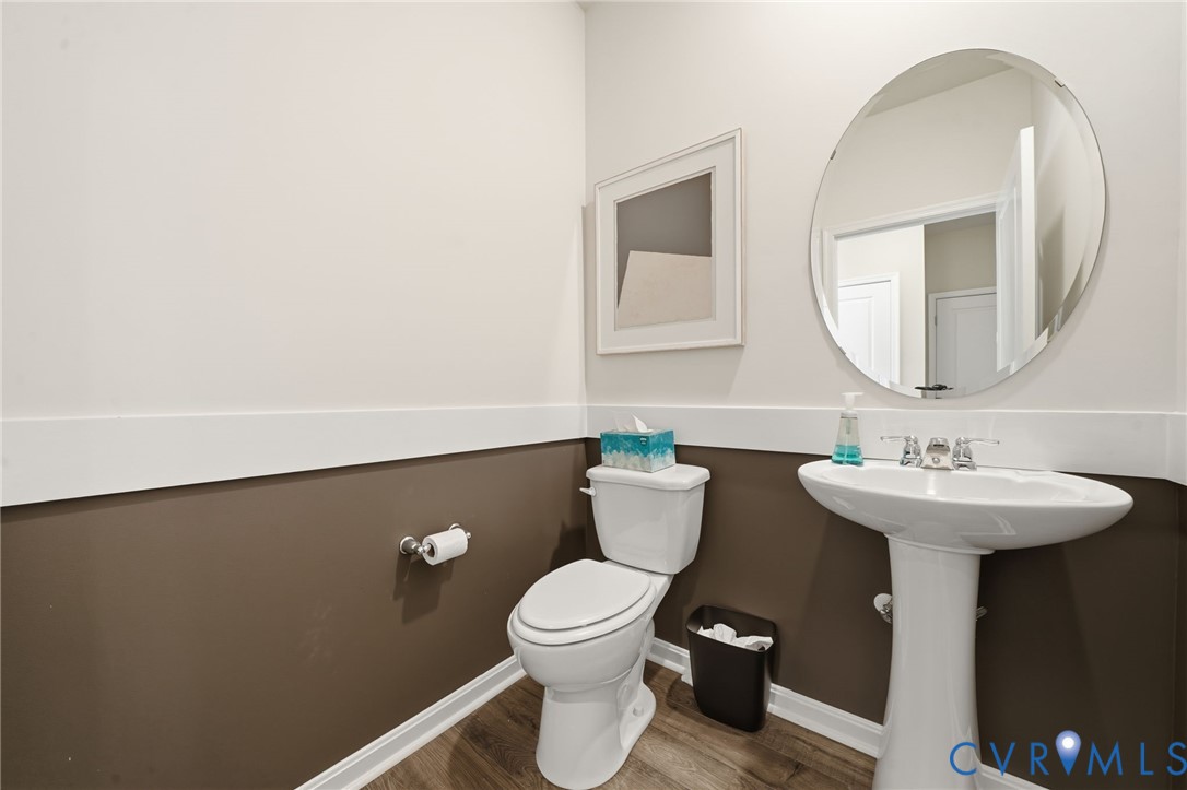 6338 Sterling Way Ruther Glen, VA 22546 - Photo 40 of 47 a bathroom with a toilet a sink and mirror